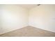An empty bedroom with neutral carpet and cream-colored walls at 2524 Harmonia Hammock Rd, Harmony, FL 34773
