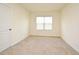 Bedroom with carpet, window, and door at 2524 Harmonia Hammock Rd, Harmony, FL 34773