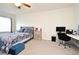 Bedroom featuring a desk, bed, and light neutral carpet at 2524 Harmonia Hammock Rd, Harmony, FL 34773