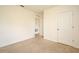 This bedroom features neutral carpet, a closet, and a door to another room at 2524 Harmonia Hammock Rd, Harmony, FL 34773