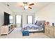 Bedroom with a ceiling fan, comfortable furnishings, and neutral color scheme at 2524 Harmonia Hammock Rd, Harmony, FL 34773
