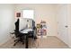 A bedroom used as an office space with window and a white door at 2524 Harmonia Hammock Rd, Harmony, FL 34773
