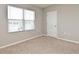 Bedroom with window and neutral walls and carpet at 2524 Harmonia Hammock Rd, Harmony, FL 34773