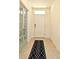 Welcoming foyer featuring neutral tile flooring and a stylish rug, setting a sophisticated tone at 2524 Harmonia Hammock Rd, Harmony, FL 34773