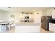 Bright kitchen with white cabinets, granite countertops, stainless steel appliances, and island at 2524 Harmonia Hammock Rd, Harmony, FL 34773