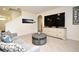 Cozy living room featuring neutral tones, modern furniture, and ample space for entertaining at 2524 Harmonia Hammock Rd, Harmony, FL 34773
