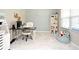 Bright home office with ample natural light, modern desk setup, and playful decor accents at 2524 Harmonia Hammock Rd, Harmony, FL 34773