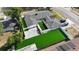 Stunning aerial view of home featuring a courtyard, backyard artificial turf, and a brick paved driveway at 2803 Tech Dr, Orlando, FL 32817