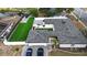 Expansive aerial view of home with luxurious green backyard, brick driveway, and well-maintained landscaping at 2803 Tech Dr, Orlando, FL 32817