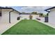 Spacious backyard with artificial turf offers a low-maintenance outdoor space at 2803 Tech Dr, Orlando, FL 32817