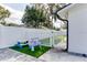Charming outdoor play area with a white picket fence and artificial turf at 2803 Tech Dr, Orlando, FL 32817
