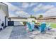 Patio seating area with brick pavers and Adirondack chairs surrounding a fire pit at 2803 Tech Dr, Orlando, FL 32817