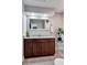 Stylish bathroom featuring a granite countertop vanity and a decorative mirror providing a modern and serene space at 2803 Tech Dr, Orlando, FL 32817