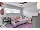 Charming bedroom featuring a ceiling fan, natural light, and decor at 2803 Tech Dr, Orlando, FL 32817