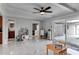 Bright, spacious bonus room with sliding glass doors and stylish marble floors at 2803 Tech Dr, Orlando, FL 32817
