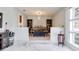 Elegant dining room featuring modern lighting, hardwood furniture, and a large window with backyard views at 2803 Tech Dr, Orlando, FL 32817