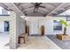 Inviting covered entry featuring white door, grey brick detail, and neutral gravel at 2803 Tech Dr, Orlando, FL 32817
