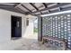 Welcoming covered entrance features a stylish brick accent wall and leads to a modern black front door at 2803 Tech Dr, Orlando, FL 32817