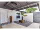 Covered entry with accent planters, grey brick wall, and neutral gravel detail at 2803 Tech Dr, Orlando, FL 32817