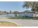 Charming single-story home featuring a brick exterior, a two-car garage, and well-maintained landscaping at 2803 Tech Dr, Orlando, FL 32817