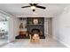 Cozy living room with brick fireplace, recessed lighting, and sliding doors to backyard, creating a relaxing atmosphere at 2803 Tech Dr, Orlando, FL 32817