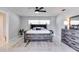 Main bedroom featuring a ceiling fan, natural light, dresser, and nightstands at 2803 Tech Dr, Orlando, FL 32817