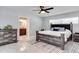 Main bedroom featuring a ceiling fan, natural light, dresser, and nightstands at 2803 Tech Dr, Orlando, FL 32817