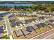 Expansive aerial view of the neighborhood showing homes near a lake and natural preserve at 292 Spirit Landings Cir, Winter Haven, FL 33880