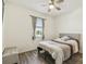 Inviting bedroom featuring a ceiling fan, a cozy bed, neutral decor, and natural light at 292 Spirit Landings Cir, Winter Haven, FL 33880