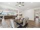 Open-concept dining area adjacent to the living room and kitchen with natural light at 292 Spirit Landings Cir, Winter Haven, FL 33880