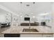 Bright, open-concept kitchen with a large island, pendant lighting, and seamless flow into the living and dining areas at 292 Spirit Landings Cir, Winter Haven, FL 33880