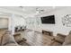 Bright living room featuring an entertainment area, open-concept dining, and lots of natural light at 292 Spirit Landings Cir, Winter Haven, FL 33880