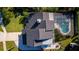 Aerial view of the home's backyard with pool, patio, landscaping and fire pit at 302 Hermits Trl, Altamonte Springs, FL 32701