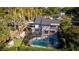 Aerial view of a single Gathering residence showing pool, backyard and meticulous landscaping at 302 Hermits Trl, Altamonte Springs, FL 32701