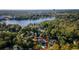A beautiful single-Gathering home surrounded by lush greenery and a serene lake, with a red outline at 302 Hermits Trl, Altamonte Springs, FL 32701