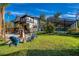 Well-kept backyard with a fire pit and seating area for outdoor gatherings and relaxation at 302 Hermits Trl, Altamonte Springs, FL 32701