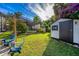 Well-maintained backyard with a cozy fire pit and lush green lawn, great for entertaining guests at 302 Hermits Trl, Altamonte Springs, FL 32701