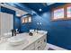 Stylish bathroom featuring double vessel sinks, white cabinetry, quartz countertop and modern fixtures at 302 Hermits Trl, Altamonte Springs, FL 32701