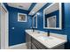 Modern bathroom with a double vanity, granite countertop, and stained glass window at 302 Hermits Trl, Altamonte Springs, FL 32701
