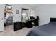 Cozy bedroom featuring a workspace, closet with sliding doors, and access to a balcony at 302 Hermits Trl, Altamonte Springs, FL 32701