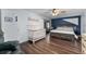 Charming bedroom with a crib, hardwood floors, and balcony access at 302 Hermits Trl, Altamonte Springs, FL 32701