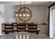 Formal dining room featuring a modern light fixture and large decorative clock at 302 Hermits Trl, Altamonte Springs, FL 32701