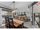 Dining room featuring a large table, open layout, and backyard swimming pool view at 302 Hermits Trl, Altamonte Springs, FL 32701