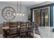 Bright dining room features a rustic wooden table and sliding doors to backyard at 302 Hermits Trl, Altamonte Springs, FL 32701