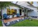 Charming front porch with Adirondack chairs, a wooden deck, and pretty landscaping at 302 Hermits Trl, Altamonte Springs, FL 32701