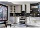 Updated kitchen with white cabinetry and stainless steel appliances at 302 Hermits Trl, Altamonte Springs, FL 32701