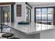 Modern kitchen island with granite countertops and seating area at 302 Hermits Trl, Altamonte Springs, FL 32701
