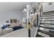 Bright living room featuring modern stairs, a comfortable seating area, and elegant decor at 302 Hermits Trl, Altamonte Springs, FL 32701