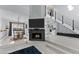 Open-concept living area featuring a fireplace, a dining space and modern stairs at 302 Hermits Trl, Altamonte Springs, FL 32701
