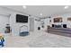 Spacious living room featuring a mounted TV, modern sliding barn door, and neutral decor at 302 Hermits Trl, Altamonte Springs, FL 32701